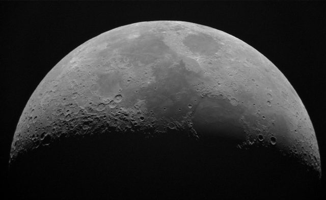 Grainy black-and-white lunar photograph with five circled areas labeled Area 1 through Area 5 above the horizon.