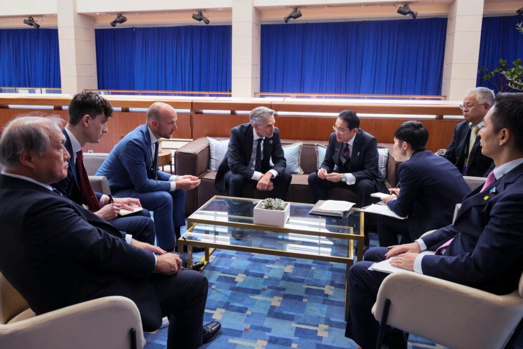 World leaders gather at a conference table during the 2025 NATO summit in The Hague, Netherlands.